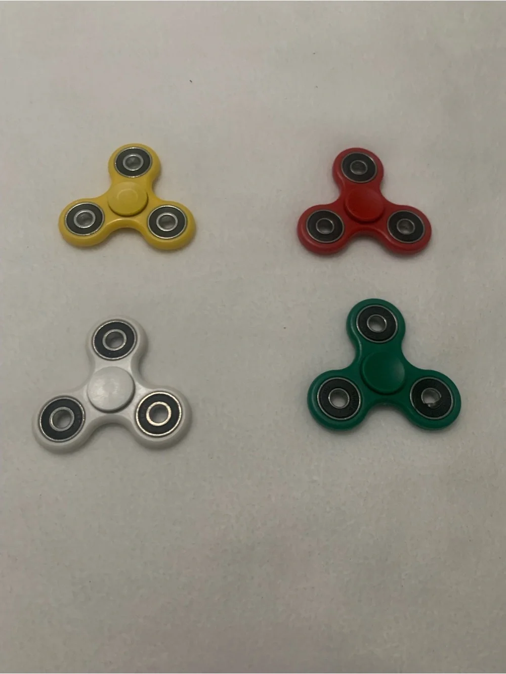 Fidget Spinner 4 Pack – Yellow, Red, White, Green